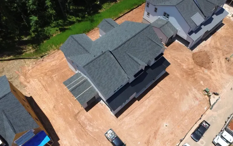 Best Suwanee Roofer team performing a free roof inspection on a residential home in Suwanee, GA